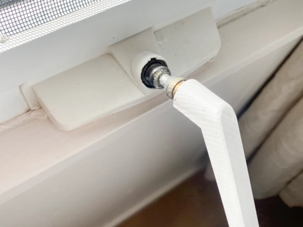 Close-up of a window crank handle requiring repair